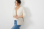 The Sak Lucia Crossbody Bag in Crochet, Convertible Purse with Adjustable Shoulder Strap - color: Woodland Stripe
